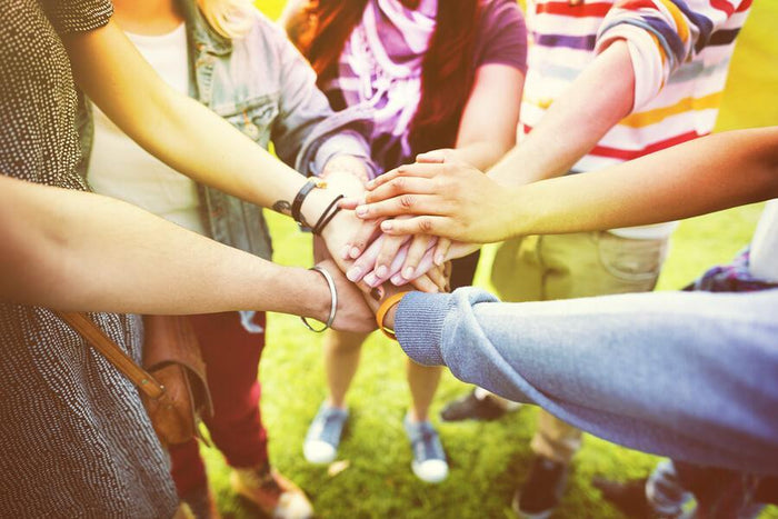 hands in the center for a cheer